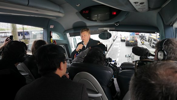 Borisovich conducts a bus tour.