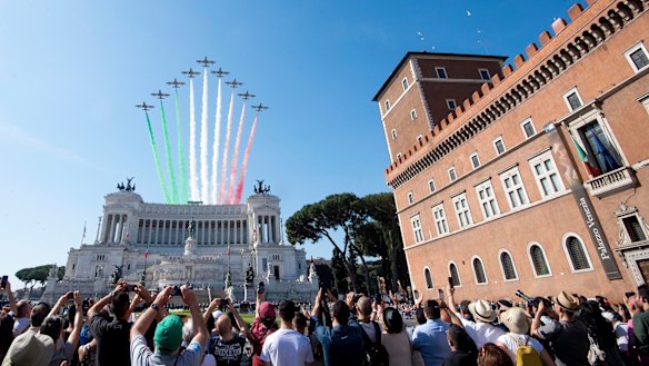 The Frecce Tricolori Italian Air Force acrobatic squad flies over the monument to the unknown soldier on the occasion of the 72nd anniversary of the Italian Republic in Rome. 