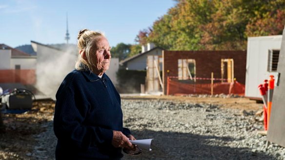 Ann Gugler, outside the heritage listed cotages at the corner of Bentham and Hutchins Sts in Yarralumla, which have been partially knocked down by developers.    rt120413Heritage-0164.jpg