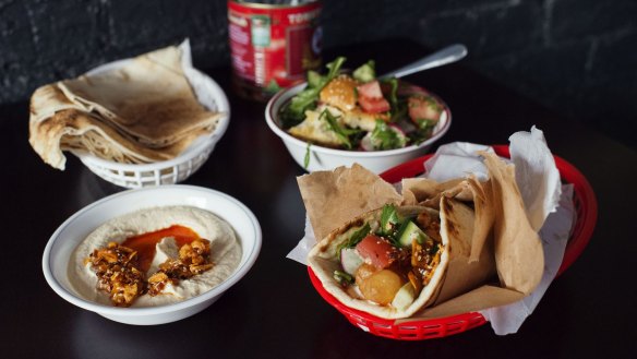 Fish kebab, village fatouche, spicy homous, fried potato & coriander and bread at Emma's Snack Bar in Enmore on October 10, 2014 in Sydney, Australi