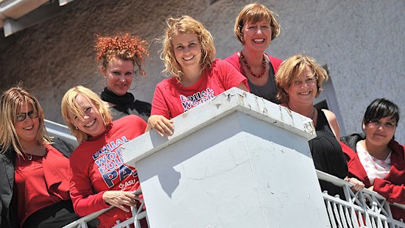 Women's health workers (left to right) Pip Robertson, Cath Lancaster, Toni Bentley, Anna Stewart, Helen Riseborough, Sandra Morris and Kei Judd celebrate the equal pay ruling.