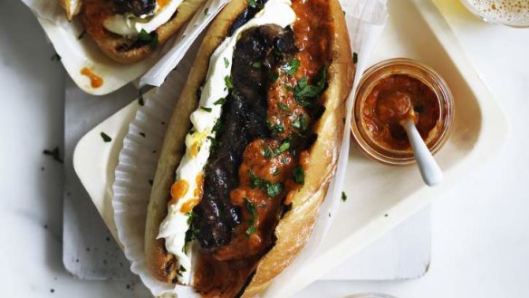 Cevapcici rolls with sweet ajvar and sour cream.