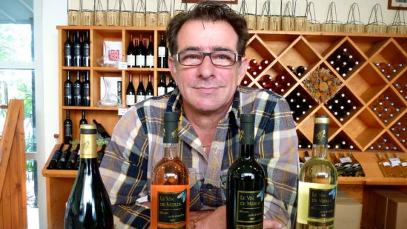 Last laugh ... Vin de Merde founder Jean-Marc Speziale with the bottles, four years on and still going strong.