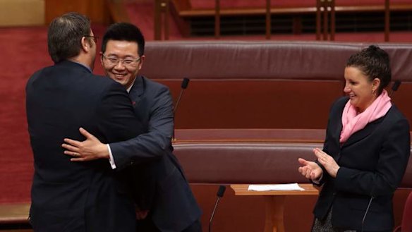 Senator Dio Wang was congratulated by Senator Glenn Lazarus and Senator Jacqui Lambie after his first speech. Photo: Andrew Meares