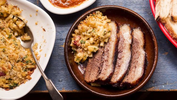 Barbecued beef brisket with mac and cheese.