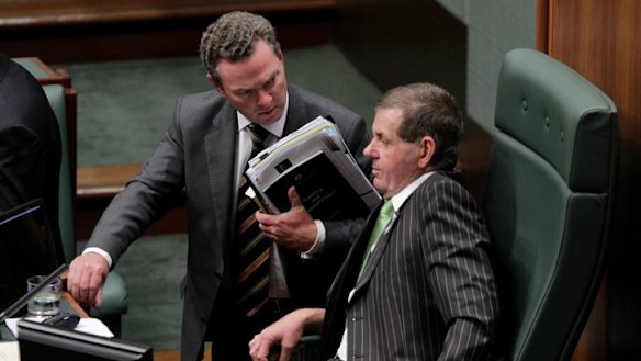 Hot seat: Manager of opposition business Christopher Pyne talks with the newly installed Speaker Peter Slipper during question time yesterday.