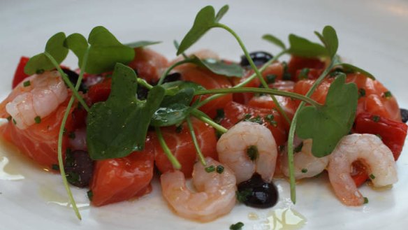 Cubed ocean trout with red peppers, black olives, wood sorrel and pink shrimp.