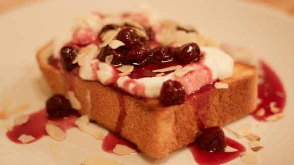 Sour cherries, buffalo yoghurt and toasted almond flakes on toast.