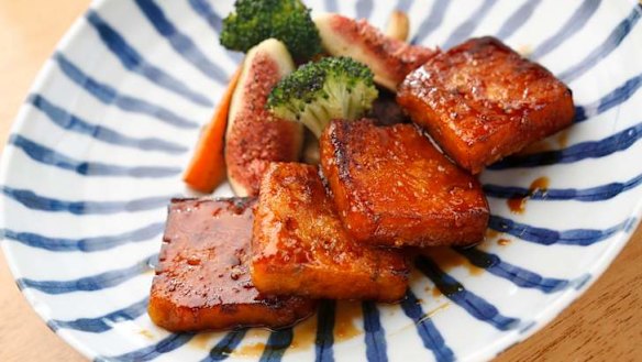 Pumpkin mochi cakes with sake and soy dressing.