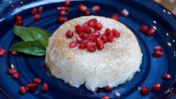 Rizogalo, the Greek version of rice pudding, comes scattered with pomegranate seeds.