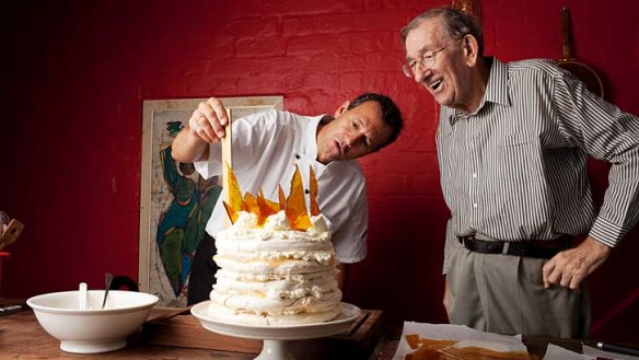 Let them eat cake &#8230; chef Martin Teplitzky making Gretta Anna's Mile High Pavlova while his father, David Teplitzky, looks on at their home in Wahroonga where a cooking school is set to reopen.