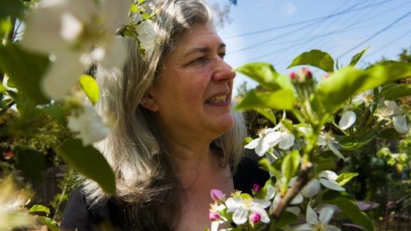 Avid kitchen gardener Megan Taylor with buds from her apple tree.