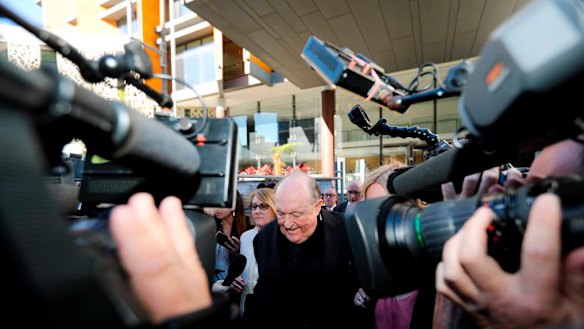 Adelaide Archbishop Philip Edward Wilson leaves court after being found guilty of concealing child sexual abuse.
