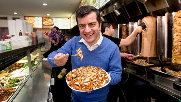 Senator Sam Dastyari samples a halal snack pack. Photograph by Edwina Pickles.