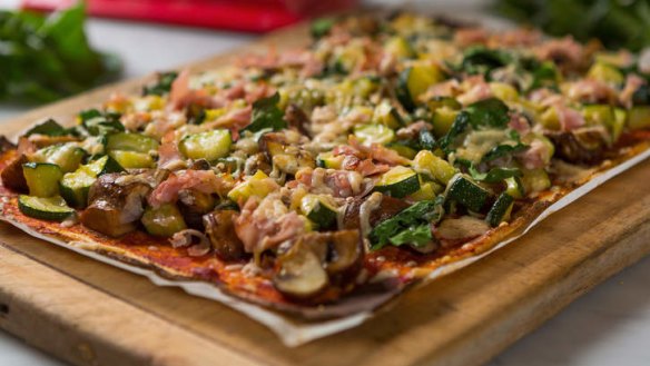 Gluten-free, low-carb cauliflower pizza base with topping.
