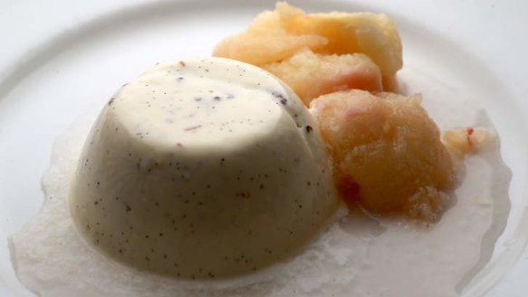 Vanilla panna cotta with prosecco-marinated white peaches.