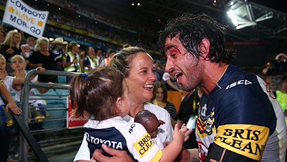 Frankie's doll: Johnathan Thurston, his partner Samantha Lynch, daughter Frankie and her doll after the grand final.