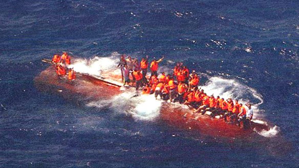 Stranded passengers aboard SIEV358 wave to attract rescuers in 2012...the death toll was 102.