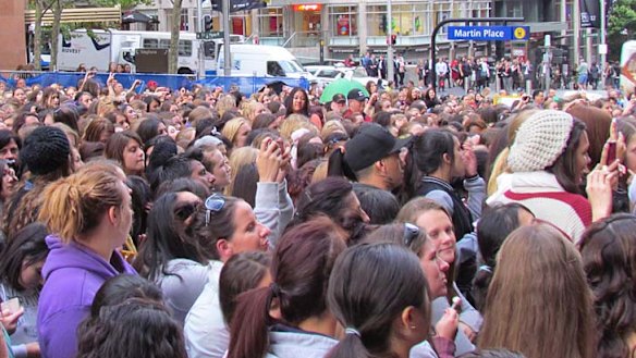 Mayhem ... fans flock to see One Direction in Sydney today.