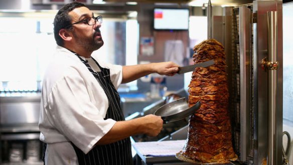 Meat for the street: Chef David Tsirekas at work.