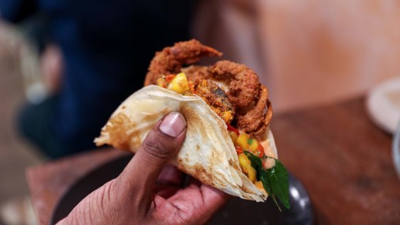 Roti taco of soft shell crab, mango salsa, fried curry leaf. 