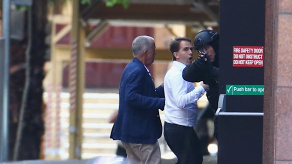 John O'Brien, left, and Stefan Balafoutis were the first two hostages to run to safety on Monday. 