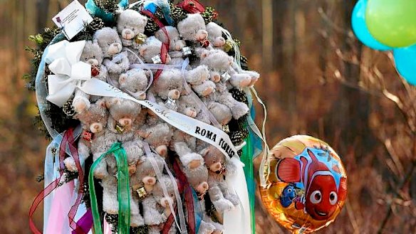 Remembering the dead … part of a makeshift memorial in Sandy Hook, Connecticut. All the children killed were six or seven years old and shot more than once with a semi-automatic rifle.