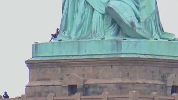 Statue of Liberty protest: woman scales base forces evacuation on 4th July