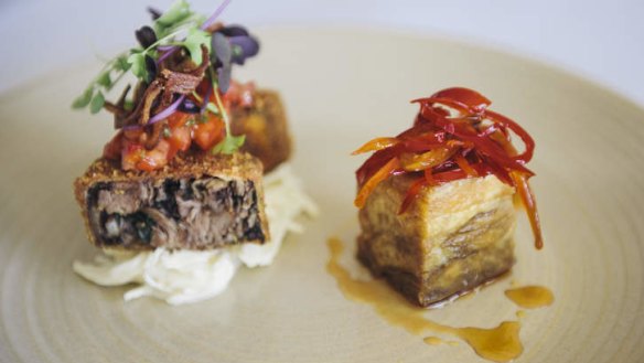 Pork assiette includes belly with chilli lime caramel, rolled shin and boudin noir, and crispy ear and herb salad.