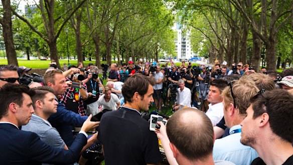 Pressing issue: The media were out in force to speak to Roger Federer on Monday.