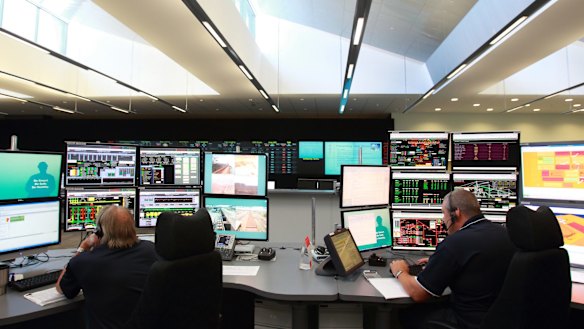 Rio Tinto staff monitor activity in the operations centre in Perth, where trucks and rigs are controlled remotely in the Pilbara mines.