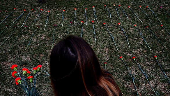 An activist places flowers on the West Front of the Capitol that they said are to memorialise children killed by Saudi bombings in Yemen, in Washington in March. 