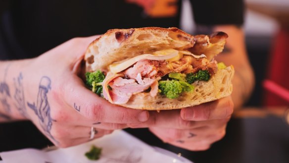 The porchetta sandwich, one of several options alongside bagels and coffee at the New York deli-inspired venue.