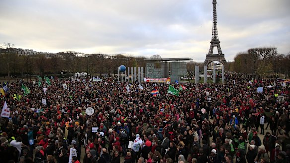 Activists gather near the Eiffel Tower.