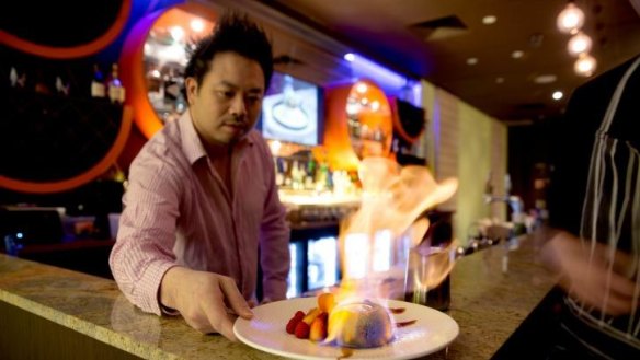 One Tea Lounge and Grill owner David Yip presents a "matcha lava bomb", a dessert dish. 