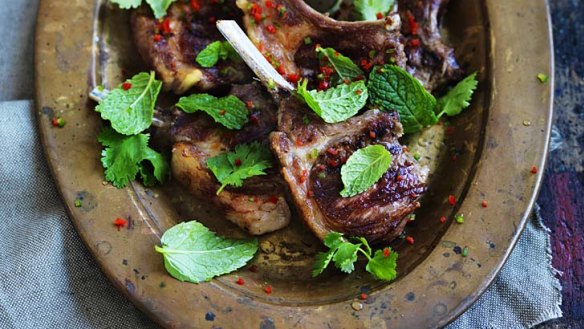 Barbecued lamb cutlets with spicy yoghurt sauce.