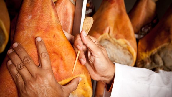 At the end of the curing phase, an inspector pierces each ham at five critical points with a porous horsebone needle.
