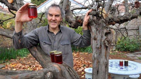 Sweet ... Barton resident, Rupert Summerson with his backyard quince tree and jars of quince jam.