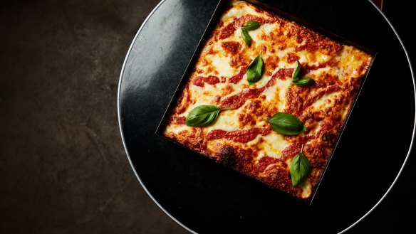 The cheese pizza from Connie's, which measures seven centimetres deep and 30 centimetres on each side.