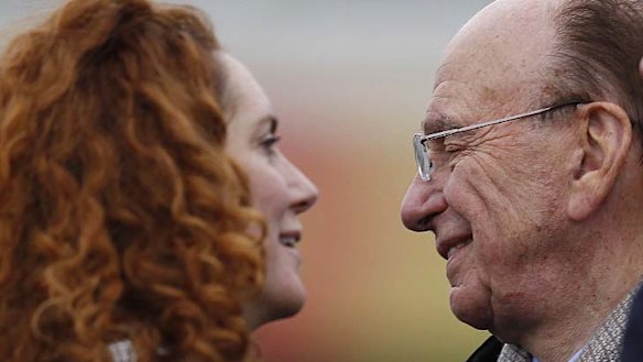 Still in her job ...  Rebekah Brooks, pictured with Rupert Murdoch.