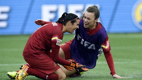 Shot-stopper: Lydia Williams celebrates with Mackenzie Arnold after Australia defeated Brazil.