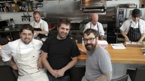 Game changer: Owners (from left)  Ludo Lefebvre, Jon Shook and Vinny Dotolo sell tickets to their Los Angeles eatery Trois Mec. Diners who arrive late miss out. 'We have had zero no-shows,' Shook says.