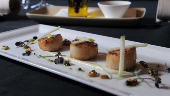 Pan-fried scallops, cauliflower puree, chorizo and apple, with raisin and pinenut dressing at Konoba in Barton.