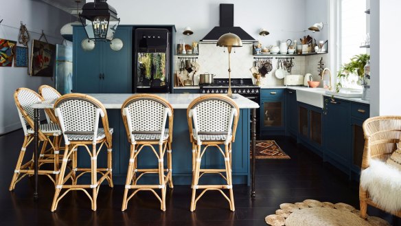 Sibella's kitchen features blue walls, handmade Moroccan tile splashback and open storage – so her favourite pieces can be seen. 