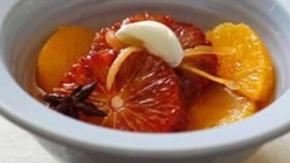 Blood oranges in spicy syrup with cinnamon yoghurt