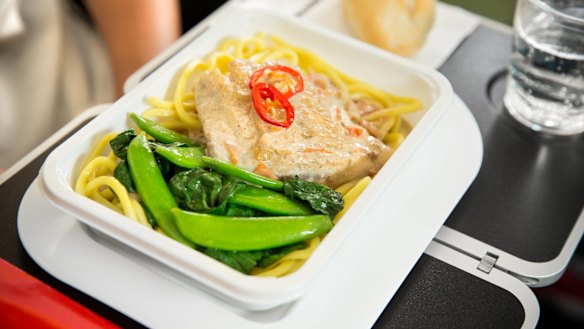 Qantas's economy meal: Barramundi poached in a spiced coconut sauce with noodles, sugar snaps, choy sum and chilli. 