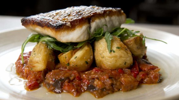 Perfectyle cooked ... The barramundi with spiced eggplant and crispy potatoes.