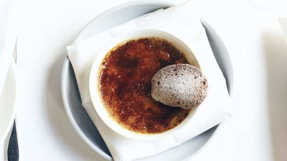 Wattle seed creme brulee topped with a chocolate madeleine.