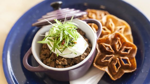 Chinese pretzels with chilli pork mince, spring onions and poached egg.