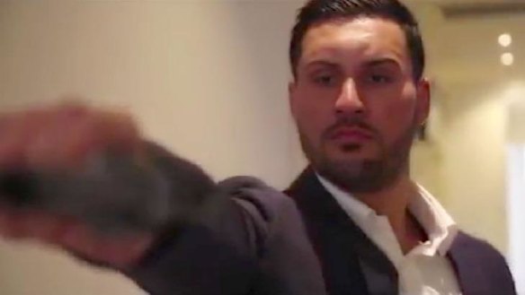 In a dramatic scene from the pre-wedding video, Salim Mehajer is depicted holding and firing a gun. 